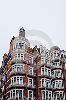 Traditional red brick apartment block in Kensington and Chelsea, London, UK