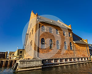 Traditional red brick building by the canal in Copenhagen, Denmark