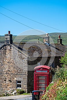 Traditional Red Phone box and cottage