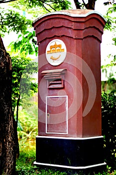 Traditional red postbox in Thailand