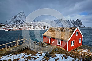 Traditional red rorbu house in Reine village on Lofoten Islands,