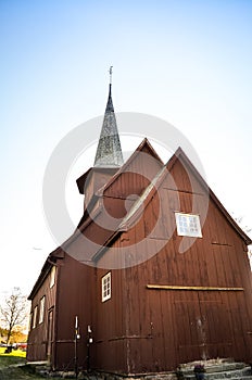 Traditional red stave church and blue sky