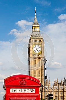 Traditional Red Telephone Box and Big Ben in London, UK