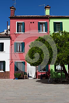 Traditional red village house in Burano, Venice, Italy