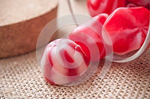 traditional red and white candies falling from glass