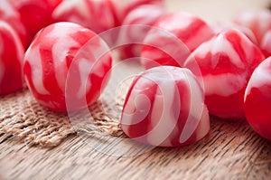 traditional red and white candies on wooden backgroun