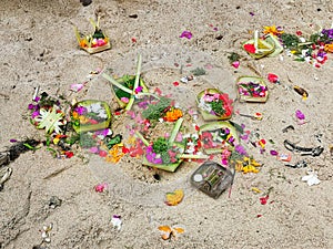 Traditional religious daily offering at balinese hindu temple on Bali island in Indonesia