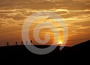 Traditional Rice Carriers in Sunrise Vietnam