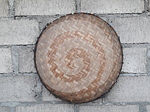 A traditional rice cleaning tool made of bamboo, thinly sliced â€‹â€‹and woven