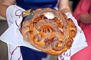 A traditional ritual of offering bread and salt to a welcome guest.