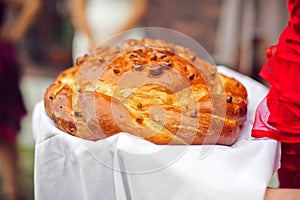 A traditional ritual of offering bread and salt to a welcome guest.