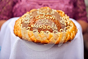 A traditional ritual of offering bread and salt to a welcome guest.