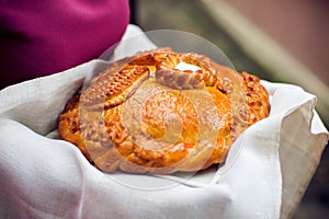 A traditional ritual of offering bread and salt to a welcome guest.