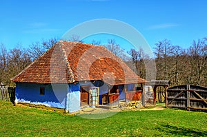 Traditional Romanian clay house with grass yard