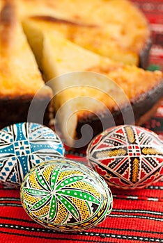 Traditional romanian easter bread pasca with cheese and raisins and nicely decorated easter eggs orthodox tradition