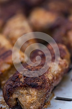 Traditional Romanian food called "mici" which consist of pork meat rolls