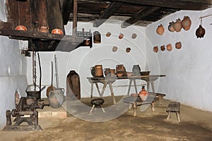 Traditional romanian interior of a kitchen with many tools and a