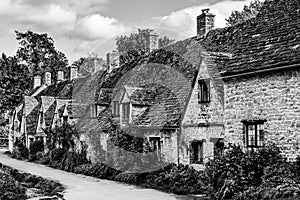 Traditional row of cottage homes in Bibury village Cotswolds, England, UK