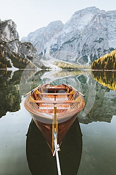 Traditional rowing boat at Lago di Braies at sunrise in fall, South Tyrol, Italy