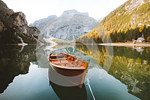 Traditional rowing boat on a lake in the Alps in fall