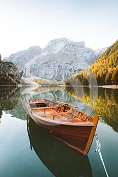 Traditional rowing boat on a lake in the Alps in fall