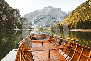 Traditional rowing boat on a lake in the Alps in fall