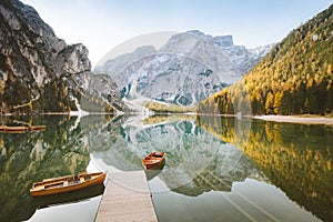 Traditional rowing boats at Lago di Braies in the Alps in fall