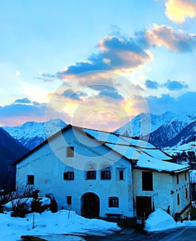 Traditional rural house in the dawn in Grisons, Switzerland