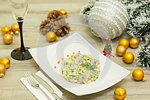 Traditional Russian christmas salad Olivier with sausage and fresh cucumbers