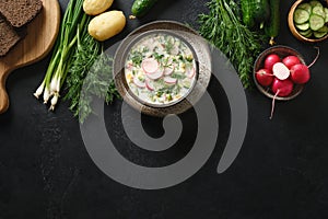 Traditional Russian cold okroshka soup with kefir or airan photo