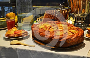 Traditional Russian food. Bread, pies,pancakes samovar with tea