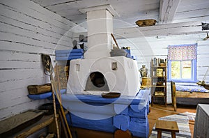 Traditional Russian oven in the interior of the Shorsky wooden house built in 1912 in the Siberian village