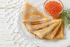 Traditional Russian pancakes blini with salmon caviar