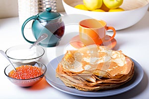 Traditional Russian pancakes with caviar and sour cream. Shrovetide