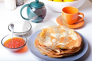 Traditional Russian pancakes with caviar and sour cream. Shrovetide