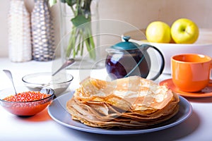 Traditional Russian pancakes with caviar and sour cream. Shrovetide