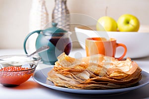 Traditional Russian pancakes with caviar and sour cream. Shrovetide