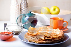 Traditional Russian pancakes with caviar and sour cream. Shrovetide