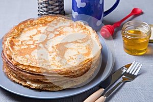 Traditional Russian pancakes with honey. Shrovetide.