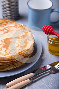 Traditional Russian pancakes with honey. Shrovetide.