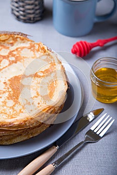 Traditional Russian pancakes with honey. Shrovetide.