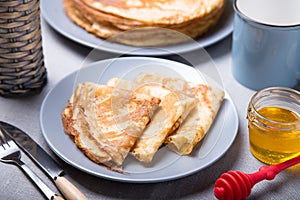 Traditional Russian pancakes with honey. Shrovetide.