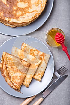 Traditional Russian pancakes with honey. Shrovetide.