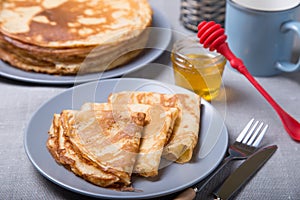 Traditional Russian pancakes with honey. Shrovetide.