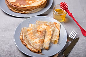 Traditional Russian pancakes with honey. Shrovetide.