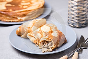 Traditional Russian pancakes with meat.