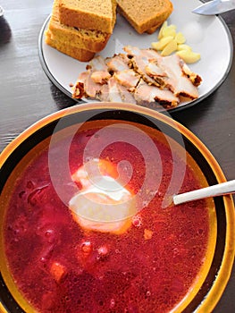 Traditional Russian red borscht on a plate.