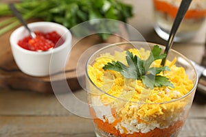Traditional russian salad Mimosa served on table, closeup. Space for text