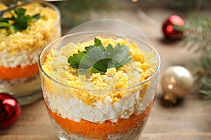 Traditional russian salad Mimosa on table, closeup