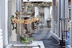 Traditional Russian samovar with bagels in a street cafe.